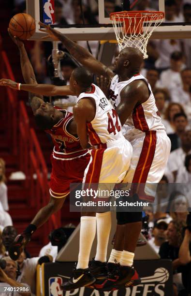 Ben Gordon of the Chicago Bulls tangles with Shaquille O'Neal and teammate Forward James Posey of the Miami Heat in Game Three of the Eastern...
