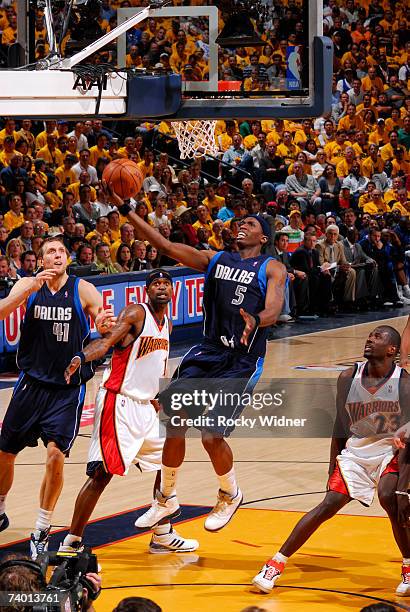 Josh Howard of the Dallas Mavericks hooks the ball up to the basket against the Golden State Warriors in Game Three of the 2007 NBA Finals on April...