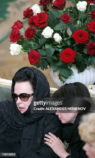 Moscow, RUSSIAN FEDERATION: Galina Vishnevskaya , the widow and daughter Olga sit near the coffin of Mstislav Rostropovich, the legendary Russian...