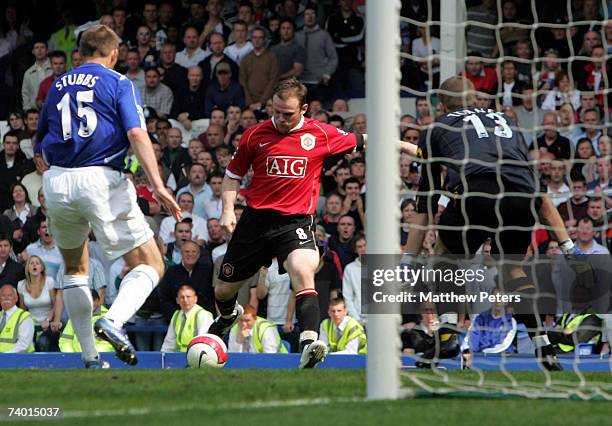 Wayne Rooney of Manchester United scores their third goal during the Barclays Premiership match between Everton and Manchester United at Goodison...