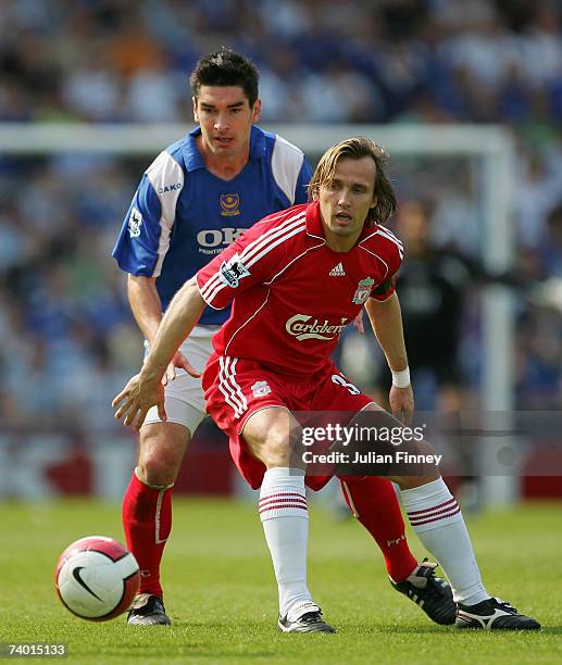 Richard Hughes of Portsmouth battles with Boudewijn Zenden of Liverpool during the Barclays Premiership match between Portsmouth and Liverpool at...