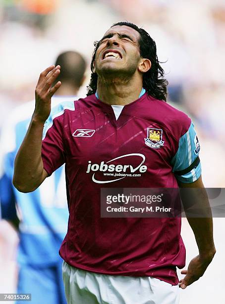 Carlos Tevez of West Ham reacts after missing a chance on goal during the Barclays Premiership match between Wigan Athletic and West Ham United at...