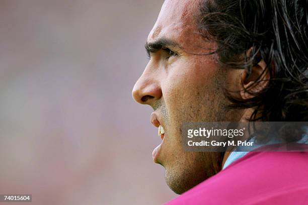 Carlos Tevez of West Ham looks to take a corner during the Barclays Premiership match between Wigan Athletic and West Ham United at The JJB Stadium...