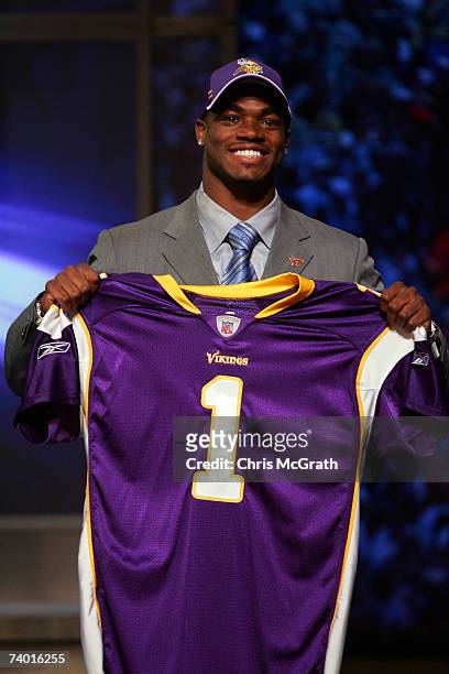 Running back Adrian Peterson of Oklahoma University poses for a photo after being drafted seventh overall by the Minnesota Vikings during the 2007...