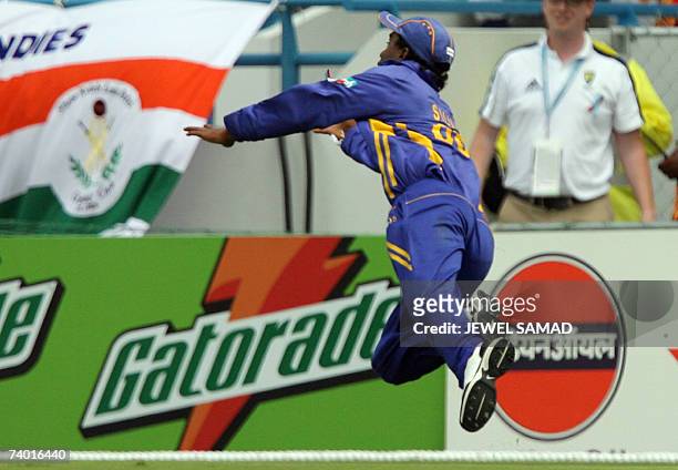 Sri Lankan cricketer Chamara Silva unsuccessfully dive to field a ball during the final match of the ICC Cricket World Cup 2007 between Australia and...