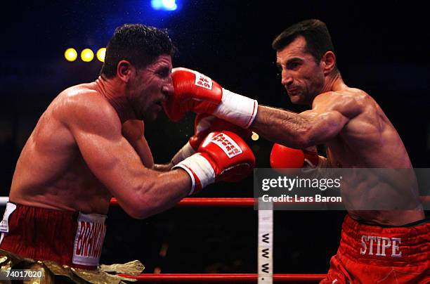 Stipe Drews of Croatia hits Silvio Branco of Italy during the WBA Light Heavyweight Championship fight between Stipe Drews and Silvio Branco at the...