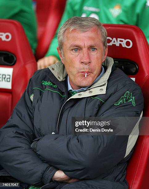 Real Betis manager Luis Fernandez sucks a lollipop before the start of the Primera Liga match between Atletico Madrid and Real Betis at the Vicente...