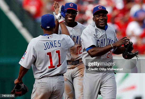 Jacque Jones, Alfonso Soriano and Felix Pie all of the Chicago Cubs celebrate a victory over the St. Louis Cardinals on April 28, 2007 at Busch...