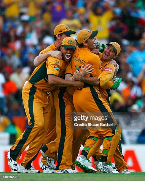 Ricky Ponting of Australia celebrates the wicket of Chamara Silva of Sri Lanka with team mates Adam Gilchrist and Andrew Symonds during the ICC...