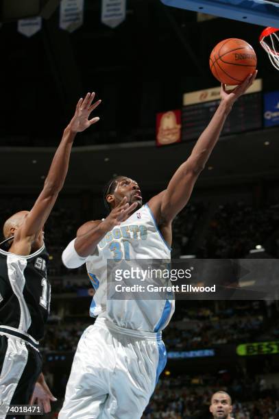 Nene of the Denver Nuggets goes to the basket against the San Antonio Spurs in Game Three of the Western Conference Quarterfinals during the 2007 NBA...