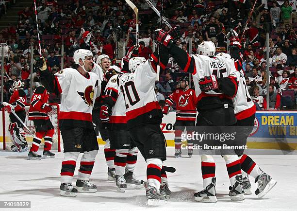 The Ottawa Senators celebrate the goal of Dany Heatley towards the end of the third period to tie the game up against the New Jersey Devils during...