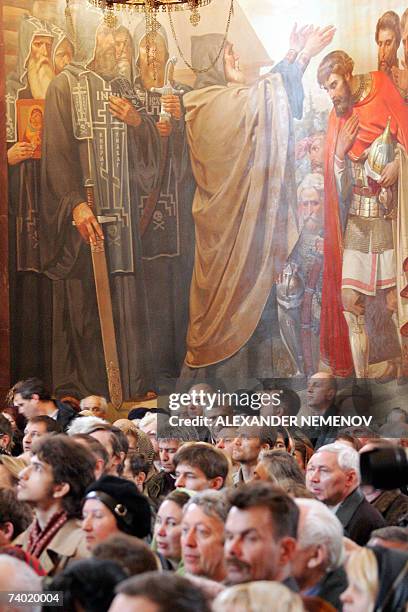 Moscow, RUSSIAN FEDERATION: People attend a burial service for the master cellist, Russian musician Mstislav Rostropovich, at Christ the Saviour...