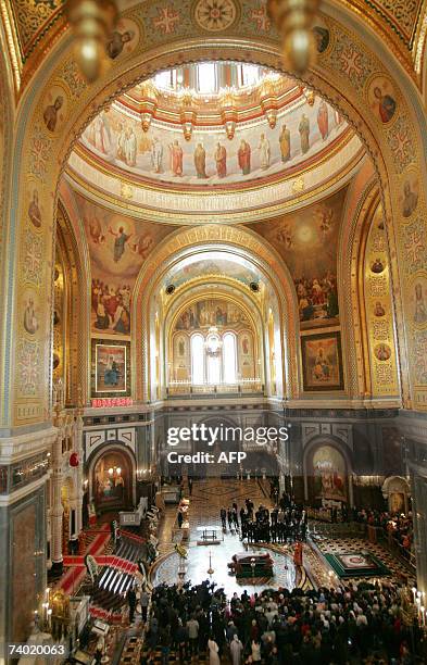 Moscow, RUSSIAN FEDERATION: People attend a burial service for the master cellist, Russian musician Mstislav Rostropovich, at Christ the Saviour...