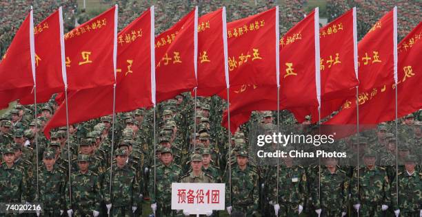 Reservists of the Chinese People's Liberation Army attend a ceremony at a stadium on April 28, 2007 in Nanjing of Jiangsu Province, China. China's...