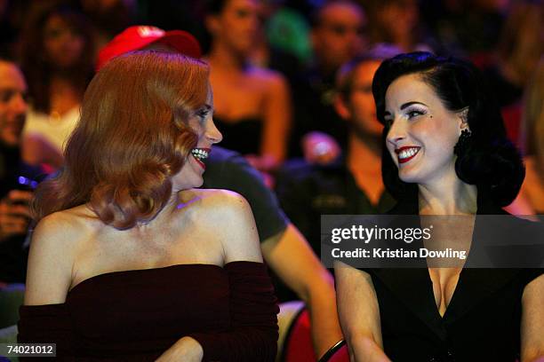 Model Dita Von Teese and guest watch the show from the audience during the third annual MTV Australia Video Music Awards 2007 at Acer Arena on April...