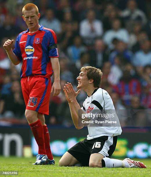 Arturo Lupoli of Derby pleads to the referee as Ben Watson of Crystal Palace looks on during the Coca Cola Championship match between Crystal Palace...