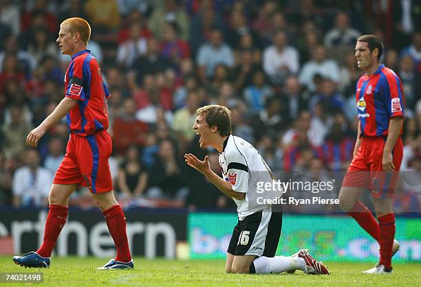 Arturo Lupoli of Derby pleads to the referee as Ben Watson of Crystal Palace looks on during the Coca Cola Championship match between Crystal Palace...