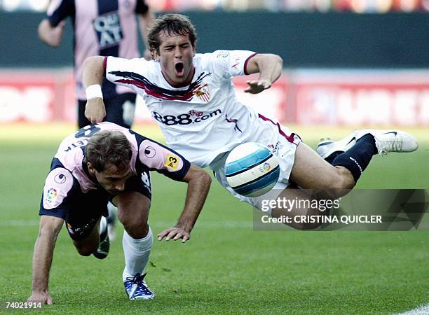 Sevilla's Russian Alexander Kerzhacov vies with Espanyol's Zabaleta David Garcia during a Spanish league football match at the Sanchez Pizjuan...