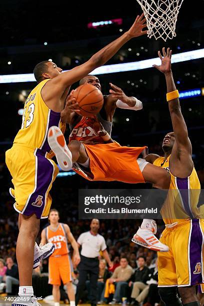 Leandro Barbosa of the Phoenix Suns goes to the basket against Brian Cook and Lamar Odom of the Los Angeles Lakers in Game Three of the Western...