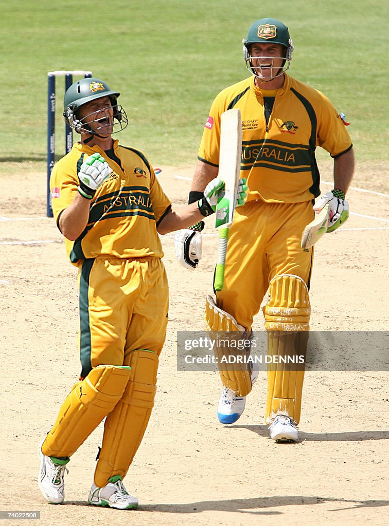 Australian cricketer Adam Gilchrist (L)...