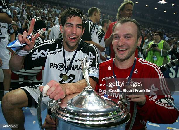 Nikola Karabatic and Thierry Omeyer of Kiel celebrate with the trophy after winning the Champions League second leg final between THW Kiel and SG...