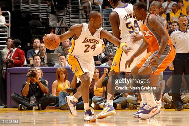 Kobe Bryant of the Los Angeles Lakers makes a move to the hoop against Amare Stoudamire of the Phoenix Suns in Game Four of the Western Conference...