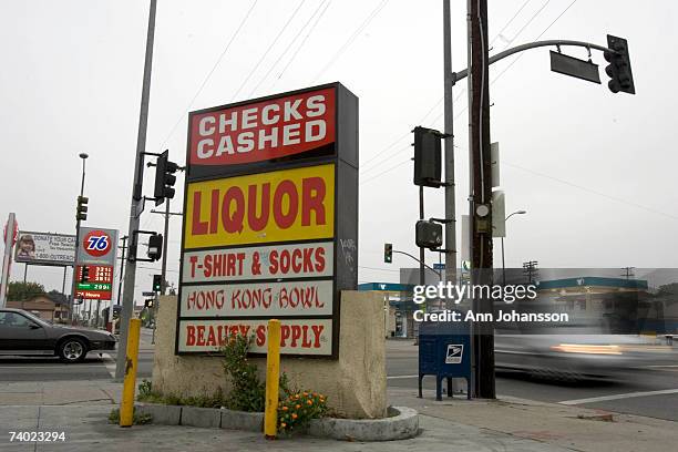 Police car drives through the intersection of Florence and Normandie April 29, 2007 in Los Angeles, California. The Los Angeles riots, which started...