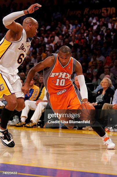 Leandro Barbosa of the Phoenix Suns drives to the basket past Maurice Evans of the Los Angeles Lakers in Game Four of the Western Conference...