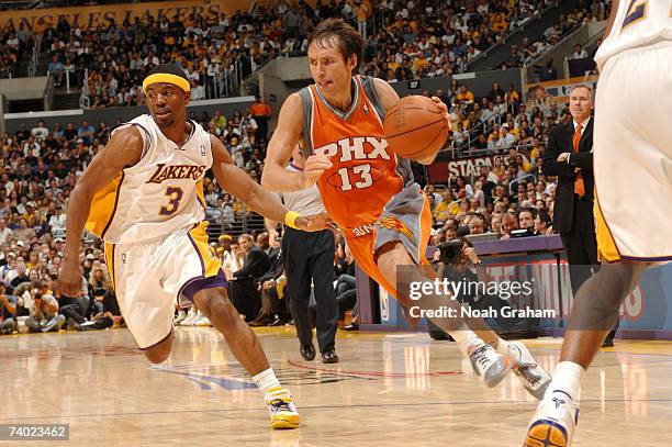 Steve Nash of the Phoenix Suns drives to the hoop against Shammond Williams of the Los Angeles Lakers in Game Four of the Western Conference...