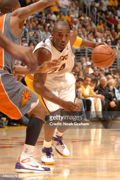 Kobe Bryant of the Los Angeles Lakers drives to the hoop against the Phoenix Suns in Game Four of the Western Conference Quarterfinals during the...