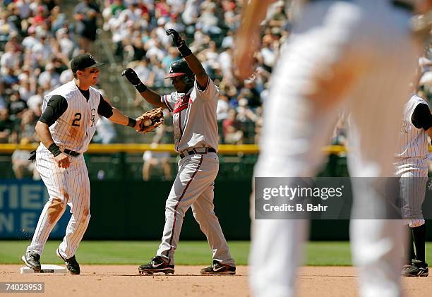 Troy Tulowitzki of the Colorado Rockies completes the 12th unassisted triple play in MLB regular season history by tagging out Edgar Renteria of the...