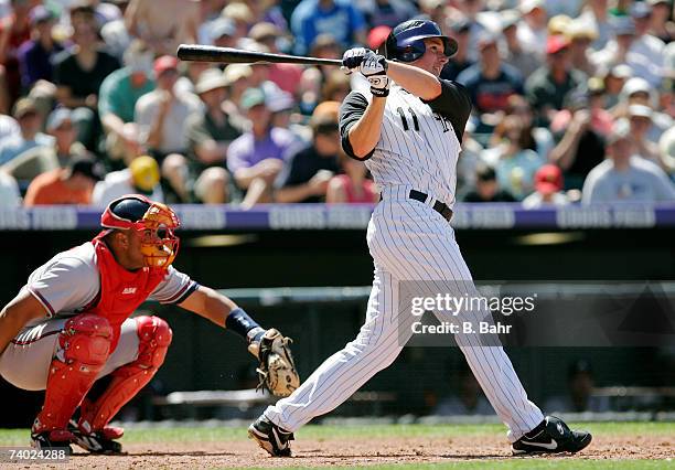 Brad Hawpe of the Colorado Rockies follows through on a solo home run against the Atlanta Braves in the fifth inning on April 29, 2007 at Coors Field...