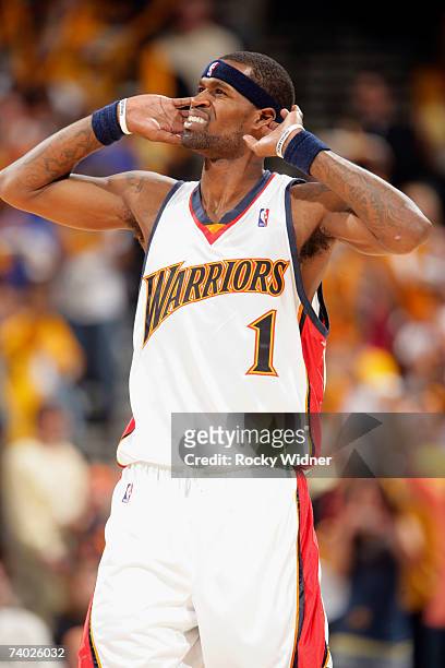 Stephen Jackson of the Golden State Warriors gestures to pump up the crowd during the game against the Dallas Mavericks in Game Four of the 2007 NBA...