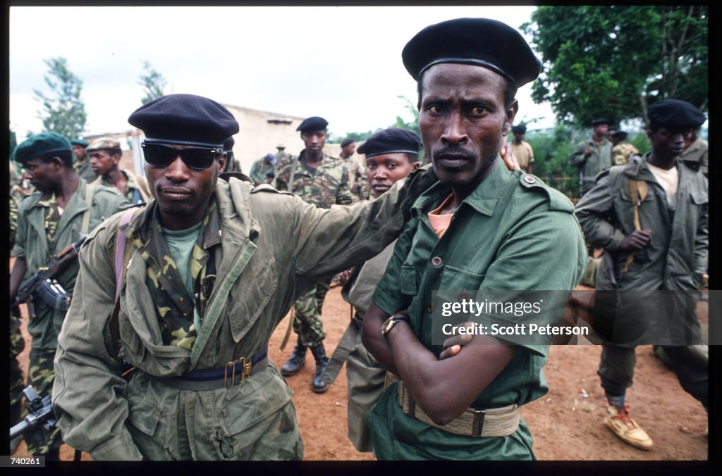 Ww1 Rwanda Armed Rwandan Patriotic Front soldiers stand on a road May 26, 1994 ...