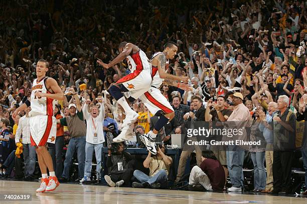 Baron Davis and Matt Barnes of the Golden State Warriors celebrates against the Dallas Mavericks in Game Four of the Western Conference Quarterfinals...