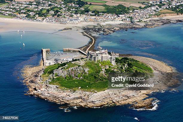 In Mount bay two miles east of Penzance is a Rocky island crowned by medieval church and castle called St Michael's Mount in this aerial photo taken...
