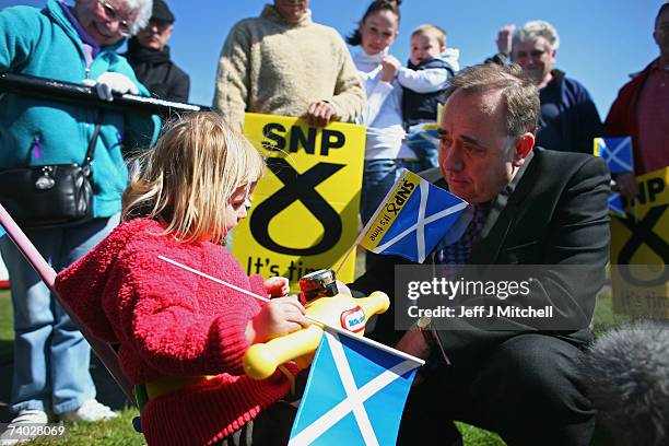 Alex Salmond, SNP leader, talks to a young girl while campaigning April 30, 2007 in Dunfermline, Scotland. The leaders of the four main parties...