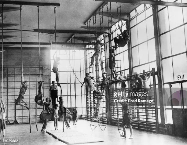 Children exercising in a in a gymnasium at the Pioneer Health Centre in Queens Road, Peckham, 1946. The centre was opened by George Scott Williamson...