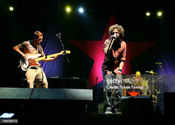 Musicians Tim Commerford, Zack De La Rocha and Brad Wilk from the band "Rage Against the Machine" perform during day 3 of the Coachella Music...