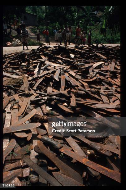 Pile of rusted machetes show the destruction June 16, 1994 near Kigali, Rwanda. Three months after the fighting began 500,000 Rwandans had been...