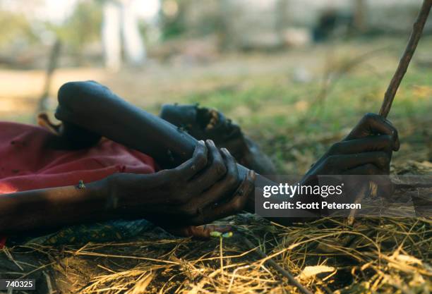 The body of a murdered Tutsi woman still clutches a root June 1994 that she had grabbed at the moment of her death, when murderous Hutu mobs murdered...