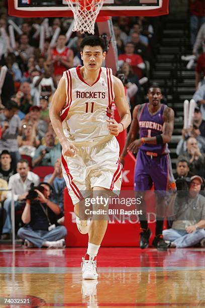 Yao Ming of the Houston Rockets runs downcourt during the game against the Phoenix Suns at the Toyota Center on April 16, 2007 in Houston, Texas. The...