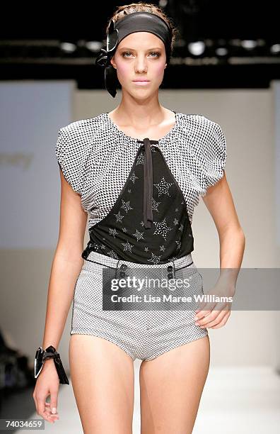 Model showcases an outfit on the catwalk by designer Milk and Honey as part of the Women's Ready To Wear number 3 Catwalk show on day two of...