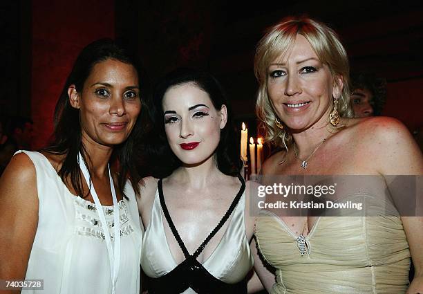 Anne Marie Carpenter, Dita Von Teese and Melanie Greensmith pose together after Dita's "Lipteese" routine as part of the Rosemount Australian Fashion...