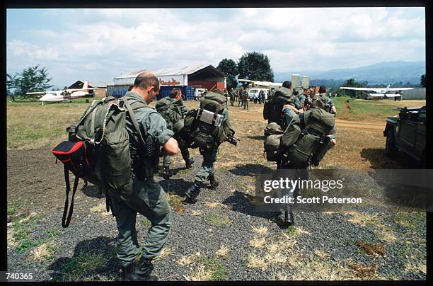 French troops arrive at the airport June 24, 1994 in Bukavu, Zaire. The soldiers will next head to the Nyarushishi Tutsi refugee camp in Rwanda to...