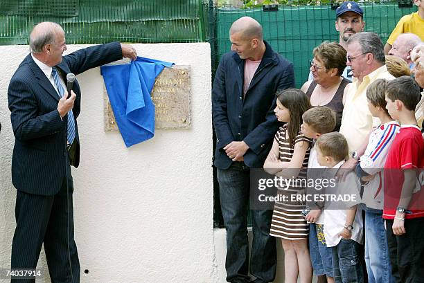 Former French football team captain Zinedine Zidane and Pegomas Mayor Gilbert Pibou attend the inauguration of a public square bearing his name next...