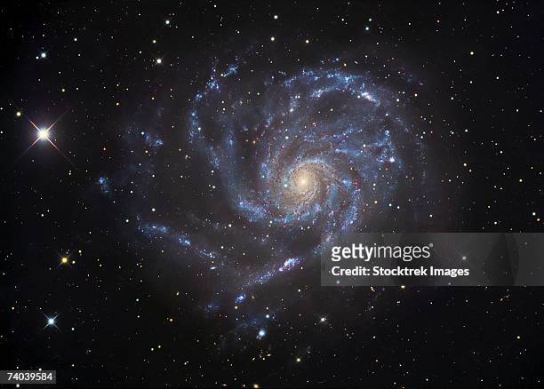 the pinwheel galaxy, also known as messier 101 or ngc 5457, is a face-on spiral galaxy in the constellation ursa major. - pinwheel galaxy stock pictures, royalty-free photos & images