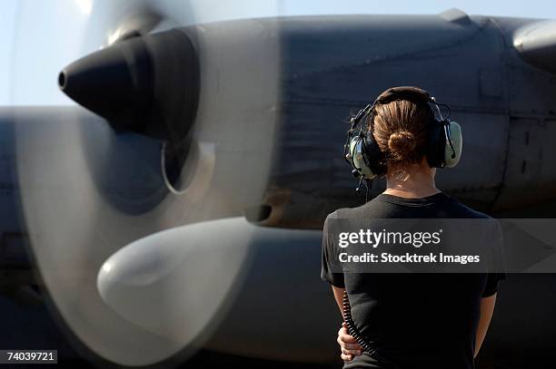 a soldier monitors the performance of a newly repaired c-130 hercules engine that had a new valve housing installed december 13 at camp lemonier, djibouti. - hercules fotografías e imágenes de stock