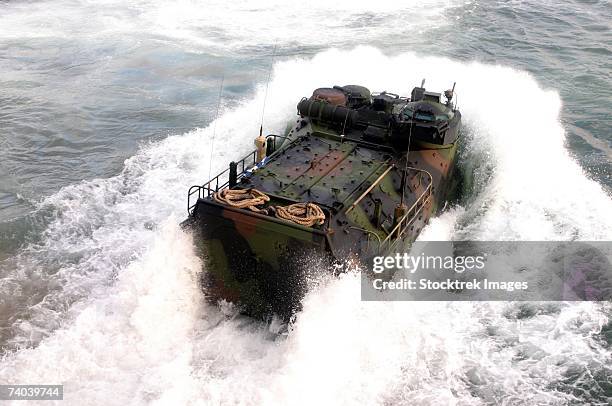 marine corps base camp lejeune, n.c. (january 10, 2005)- an amphibious assault vehicle splashes off the uss whidbey island off the coast of north carolina during ship operation training here. - military vehicle stock pictures, royalty-free photos & images