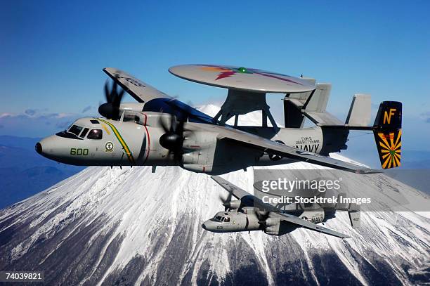 mount fuji, japan (february 15, 2007)  two e-2c hawkeyes assigned to the liberty bells of carrier airborne early warning squadron (vaw) 115 conduct a flyby of mount fuji in japan. vaw-115 is homeported at naval air facility, japan. - hummer stock pictures, royalty-free photos & images
